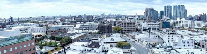 QUEENS, NEW YORK - OCTOBER 24, 2015: Panoramic view of Queens buildings. Queens is the easternmost and largest in area of the five boroughs of New York City, stock photo