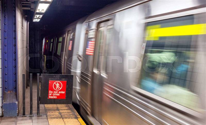 Train speeding up in New York subway, stock photo