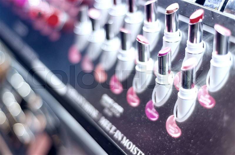 Colourful rows of lipsticks in a shop, stock photo