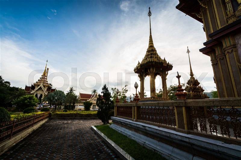 Thai style outdoor architecture with sculpture under sunlight in chalong temple, Phuket, Thailand, stock photo