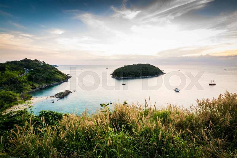 Tropical ocean landscape with a little island under dramatic blue sky, Phuket, Thailand, stock photo