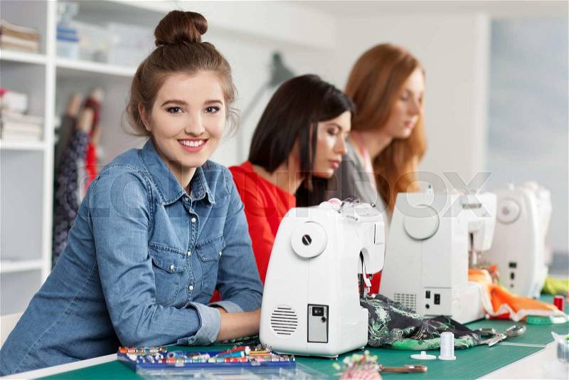 Group of women in a sewing workshop, stock photo