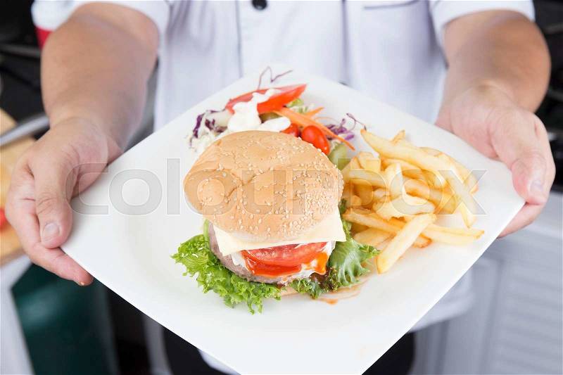 Chef presented Plate of Hamburger /Cooking Hamburger concept, stock photo