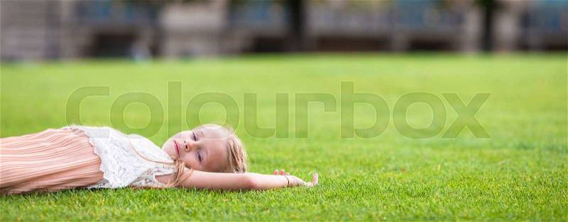 Adorable little girl in Paris background the Eiffel tower in France, stock photo