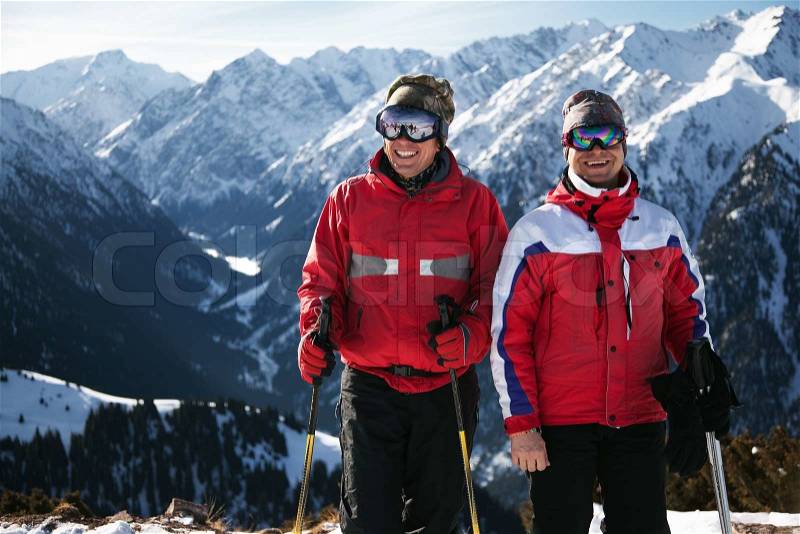 Two friends, enjoying at mountain ski resort, stock photo