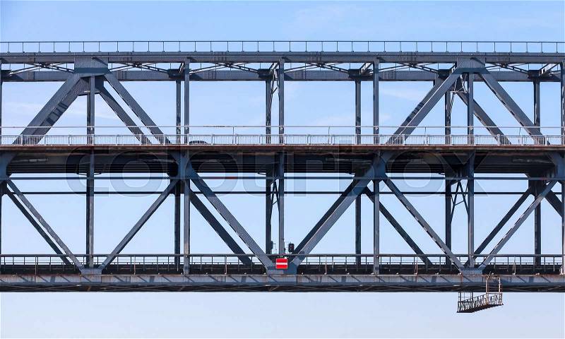 Steel truss bridge fragment with two levels of transportation, stock photo
