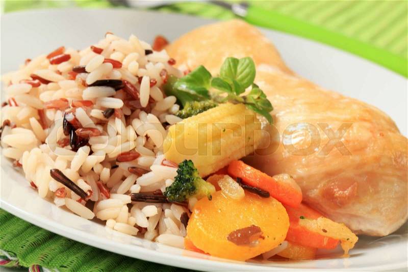 Healthy dish of mixed rice, chicken meat and vegetables, stock photo