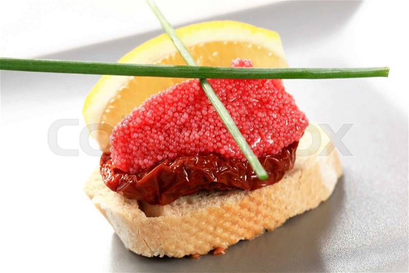 Bite-sized hors d\'oeuvre - Red caviar canape, stock photo