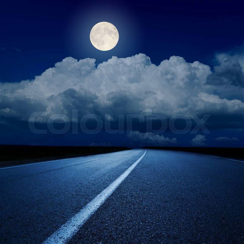 Full moon over clouds and asphalt road, stock photo