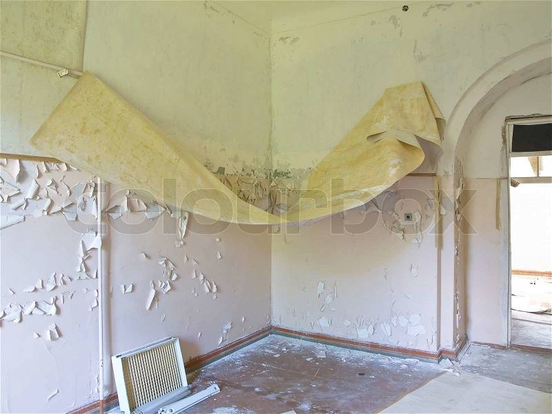 Old building ruin with scattered things inside, stock photo