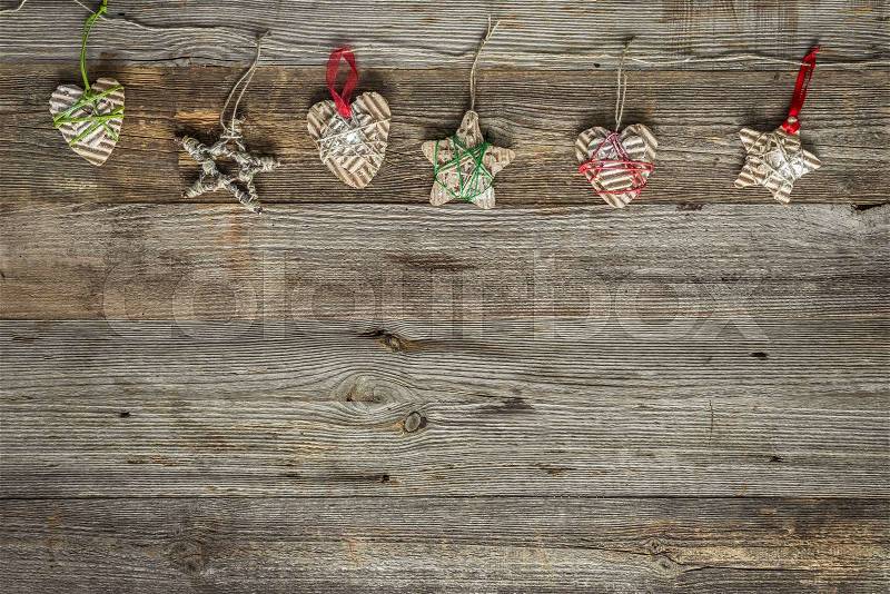Christmas handmade decorations on old wooden background with text space, stock photo