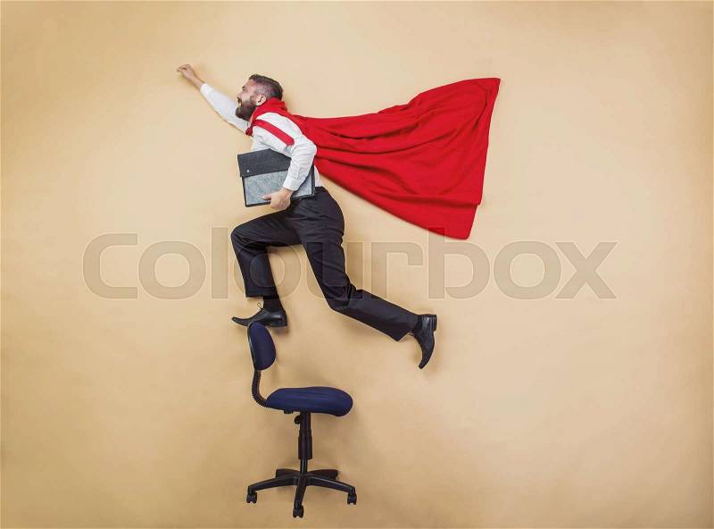 Manager with coat of superman. Superhero in studio, stock photo