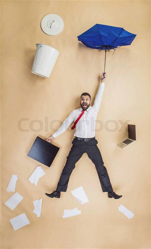 Handsome manager has an accident. Funny pose in studio, stock photo