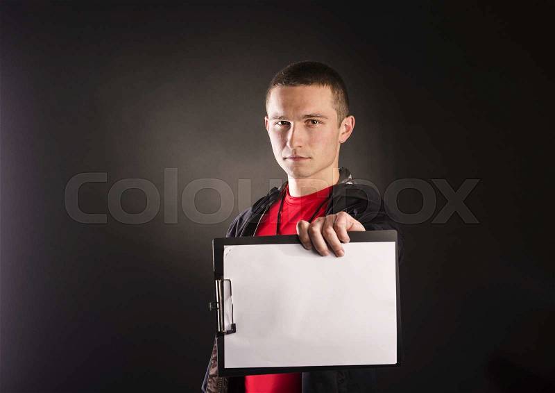 Professional fitness coach isolated on black background, stock photo