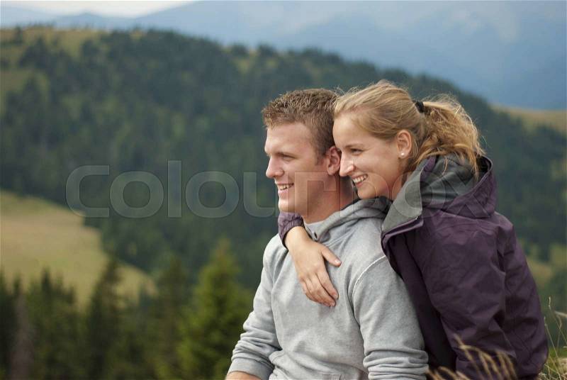 Hikers on the top of mountains are resting in the wild nature, stock photo
