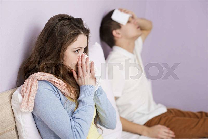 Sick woman and man have cold, flu and high fever, stock photo