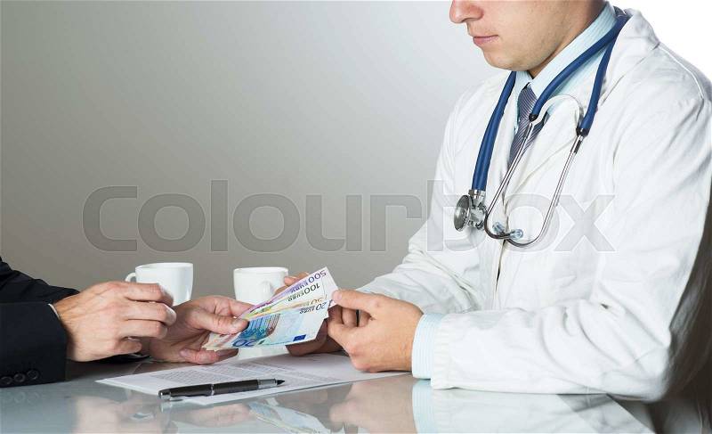 Closeup on medical doctor hands, taking money, stock photo