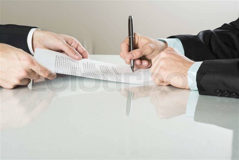 Businessmen are signing a contract, business contract details, stock photo