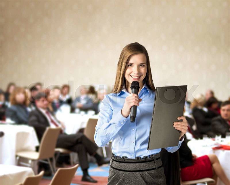 Beautiful business woman is speaking on conference, stock photo