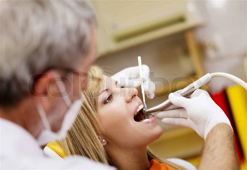 Patient is having a dental treatment, stock photo