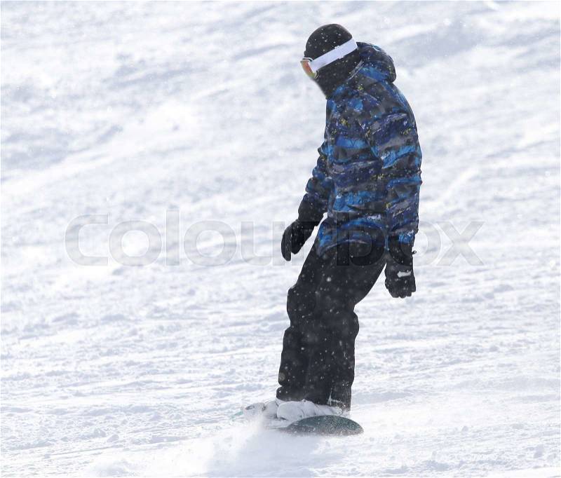 People snowboarding on the snow in the winter, stock photo