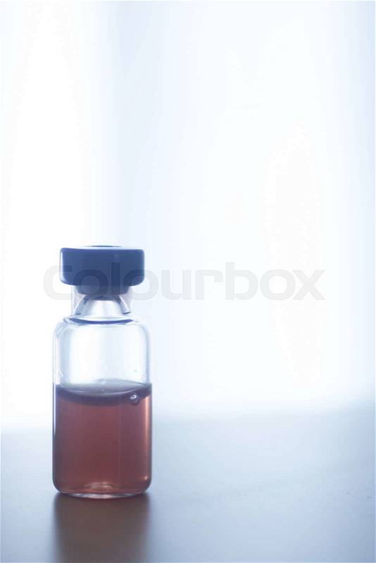 Phials of pharmaceutical insulin medication bottle in hospital clinic on table of doctor, stock photo