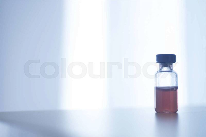 Phials of pharmaceutical insulin medication bottle in hospital clinic on table of doctor, stock photo