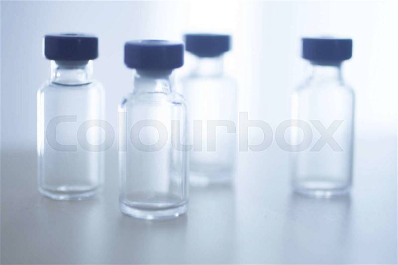 Phials of pharmaceutical insulin medication bottles in hospital clinic on table of doctor, stock photo
