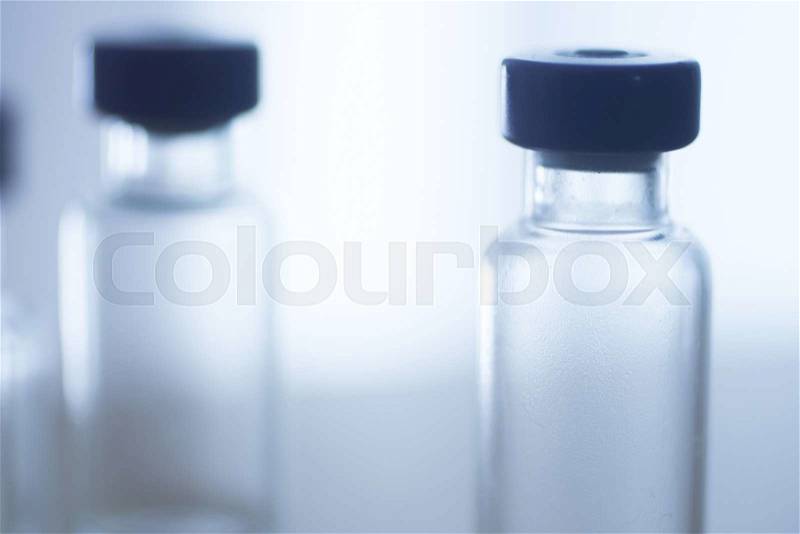 Phials of pharmaceutical insulin medication bottles in hospital clinic on table of doctor, stock photo