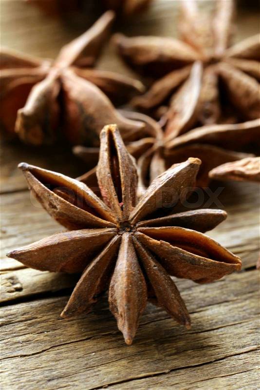 Macro shot spice star anise on a wooden background, stock photo