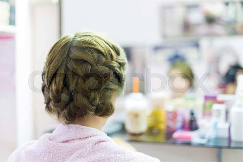 Woman long braid hair creative styling bride hairstyle in beauty salon, stock photo