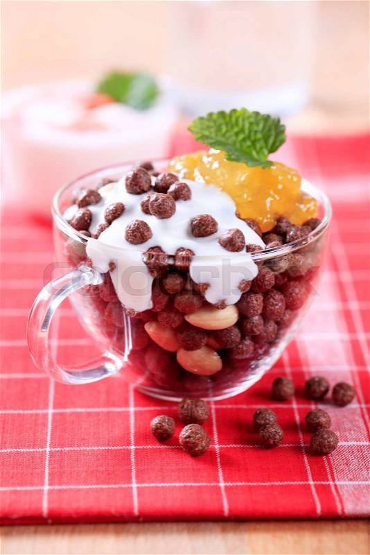 Chocolate-flavored puffs with marmalade and yogurt, stock photo