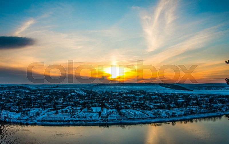 Winter landscape sunset over the village, stock photo