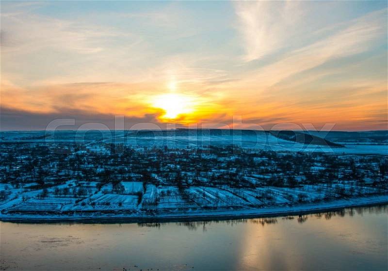 Winter landscape sunset over the village, stock photo