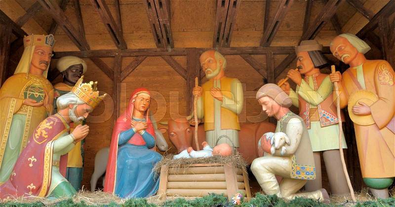 Christmas Manger scene with figurines including Jesus, Mary, Joseph, sheep and magi. , stock photo