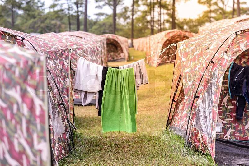 Drying towel after rains on camp site, stock photo