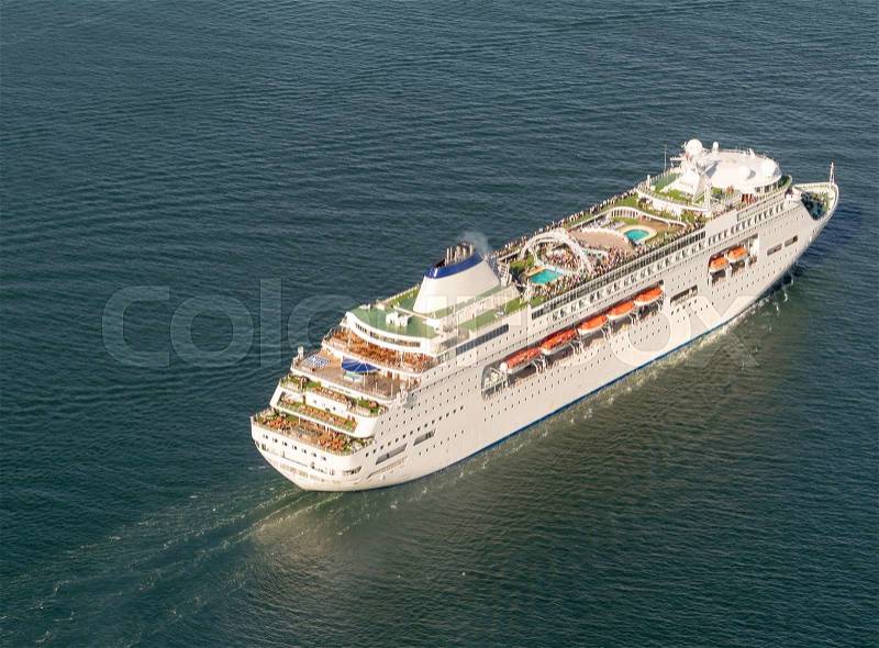 Cruise ship navigating in the ocean, stock photo