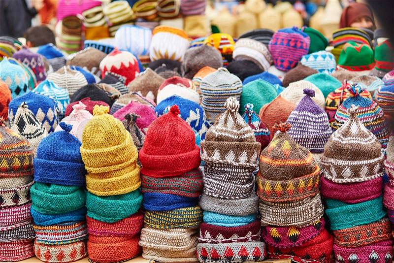 Selection of woolen hats on a traditional Moroccan market (souk) in Marrakech, Morocco, stock photo