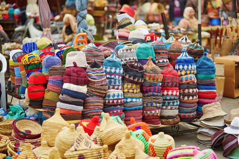 Selection of woolen hats on a traditional Moroccan market (souk) in Marrakech, Morocco, stock photo