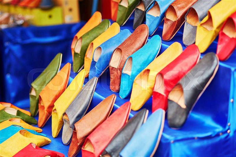Colorful handmade leather slippers (babouches) on a market in Marrakech, Morocco, stock photo