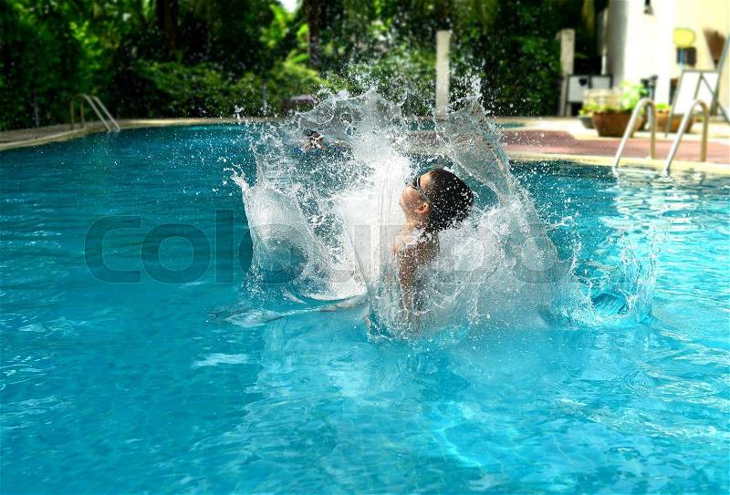 Splash water when jump in to the swiming pool, stock photo