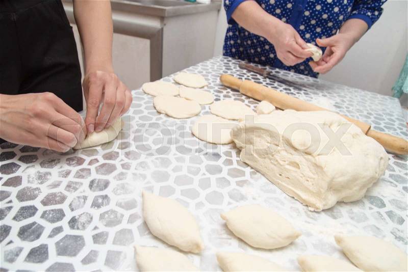 Cooking cakes of the dough in the kitchen, stock photo