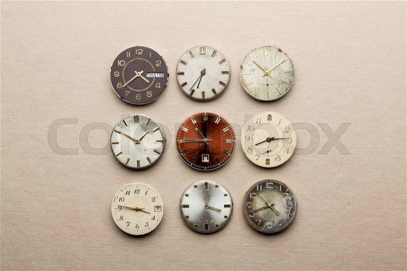 Nine clock dials showing different time, stock photo
