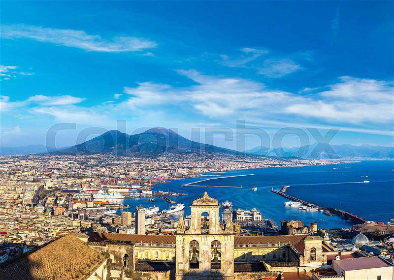 Napoli (Naples) and mount Vesuvius in the background at sunset in a summer day, Italy, Campania, stock photo
