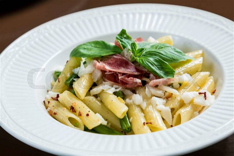 Pasta with hamon and goat cheese, stock photo