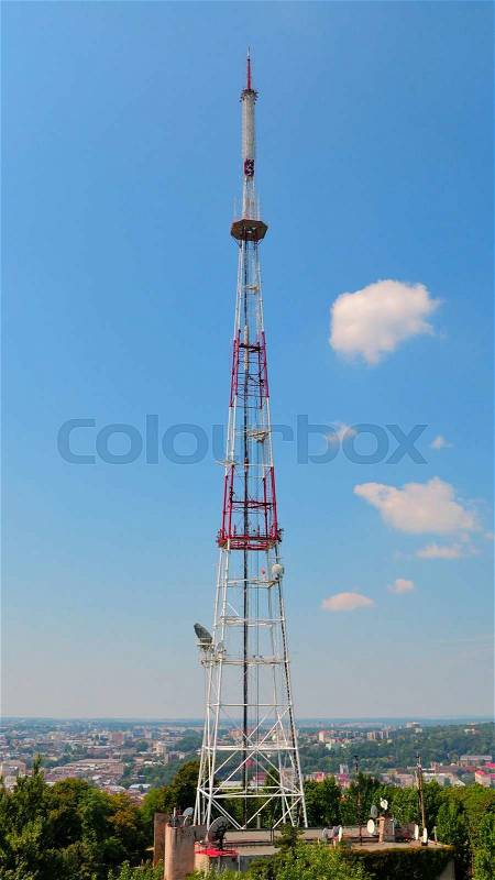 Mobile phone communication repeater antenna tower in blue sky , stock photo