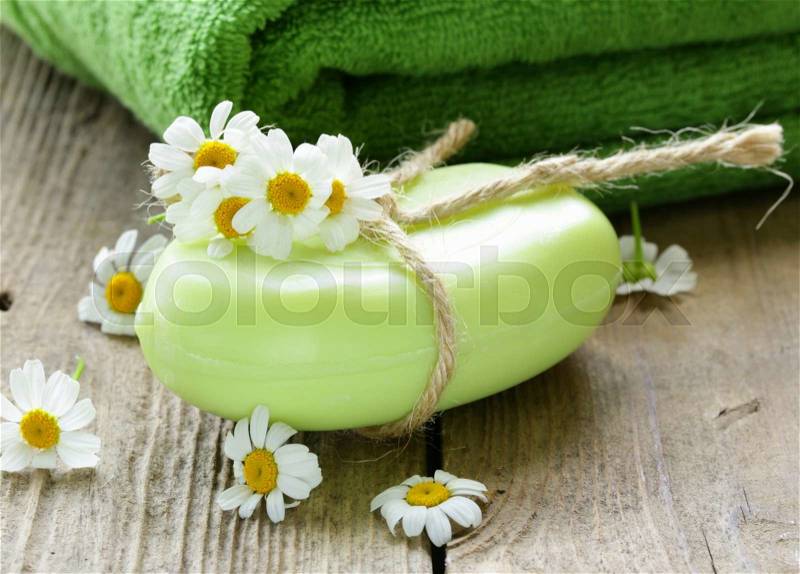 Handmade soap with flowers on the organic background, stock photo