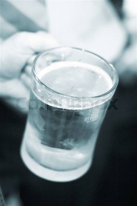 Pint glass of beer in pub bar wedding party reception in England, stock photo