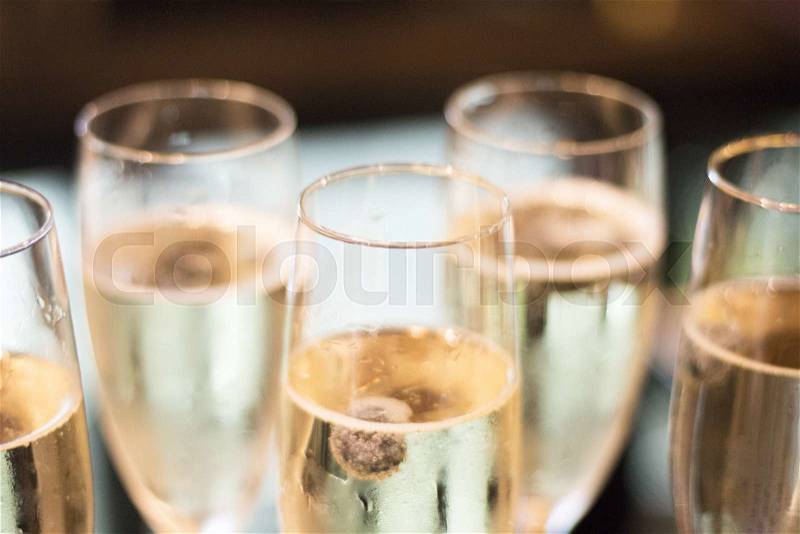 Champagne sparkling white wine glasses in restaurant bar in wedding reception party photo, stock photo