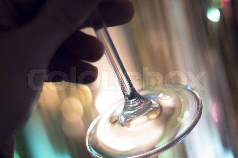 Wine glass in restaurant at night during wedding reception party, stock photo